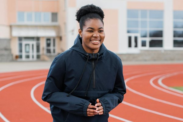 What are effective ways to monitor and improve air quality at indoor sports facilities in the UK?