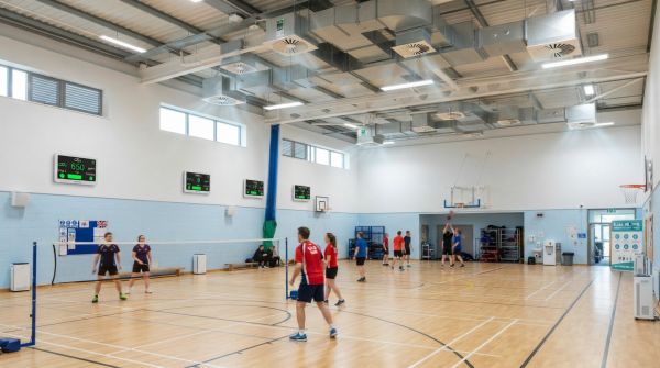 What are effective ways to monitor and improve air quality at indoor sports facilities in the UK?