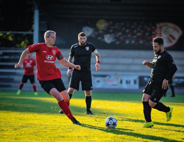 What tactical adjustments are most effective for football teams playing in wet weather conditions?
